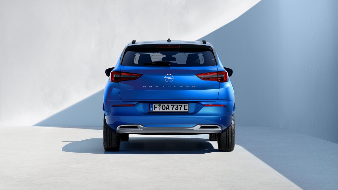 Birds-eye view of a blue Opel Grandland Plug-in-Hybrid with black roof